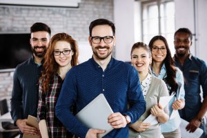 Portrait of successful young business team posing in office