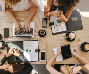 Group of women working together in coffee shop