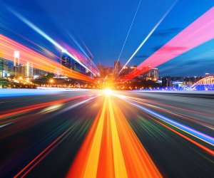 abstract image of blur motion of cars on the city road at night