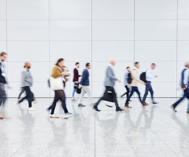 Anonymous crowd of business people on trade fair