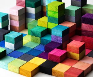 Spectrum of stacked multi-colored wooden blocks. Background or c