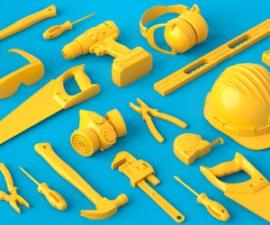 Isometric view of monochrome construction tools for repair on blue and yellow